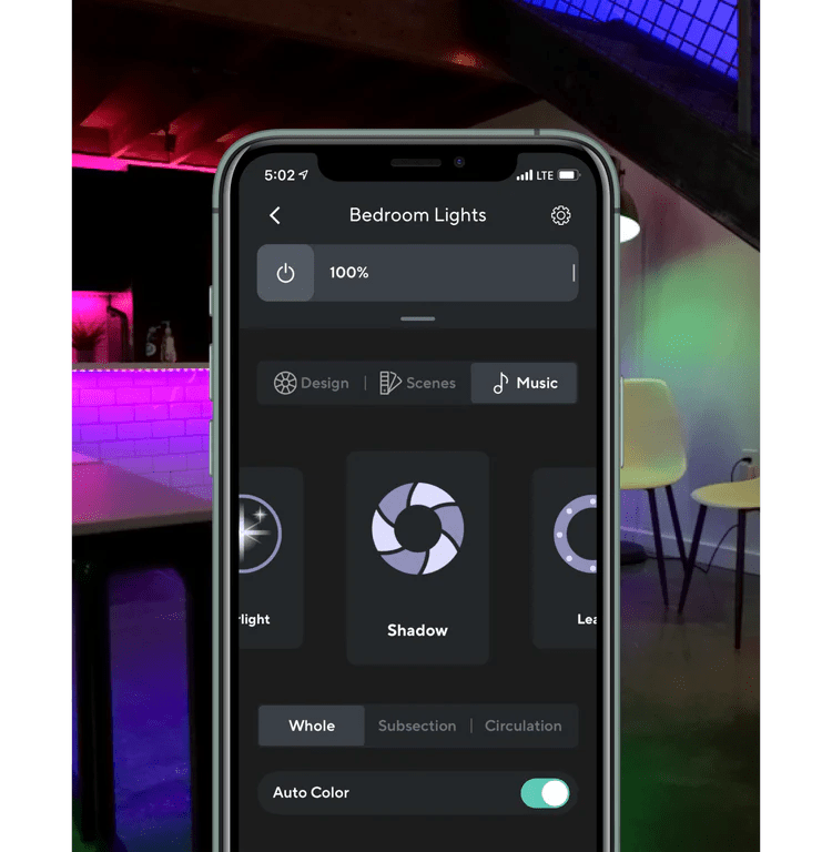 Phone with smart lighting app controls open.