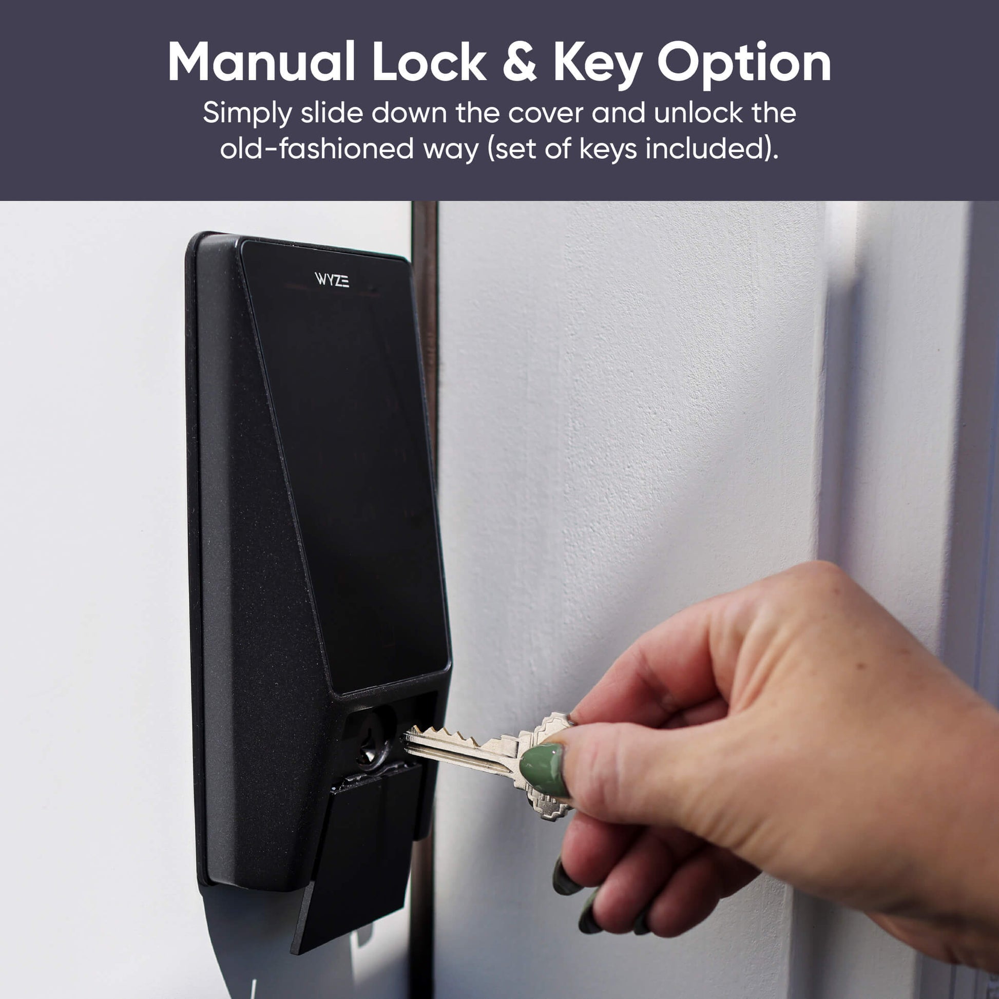 Hand using a key to unlock smart lock mechanism manually.